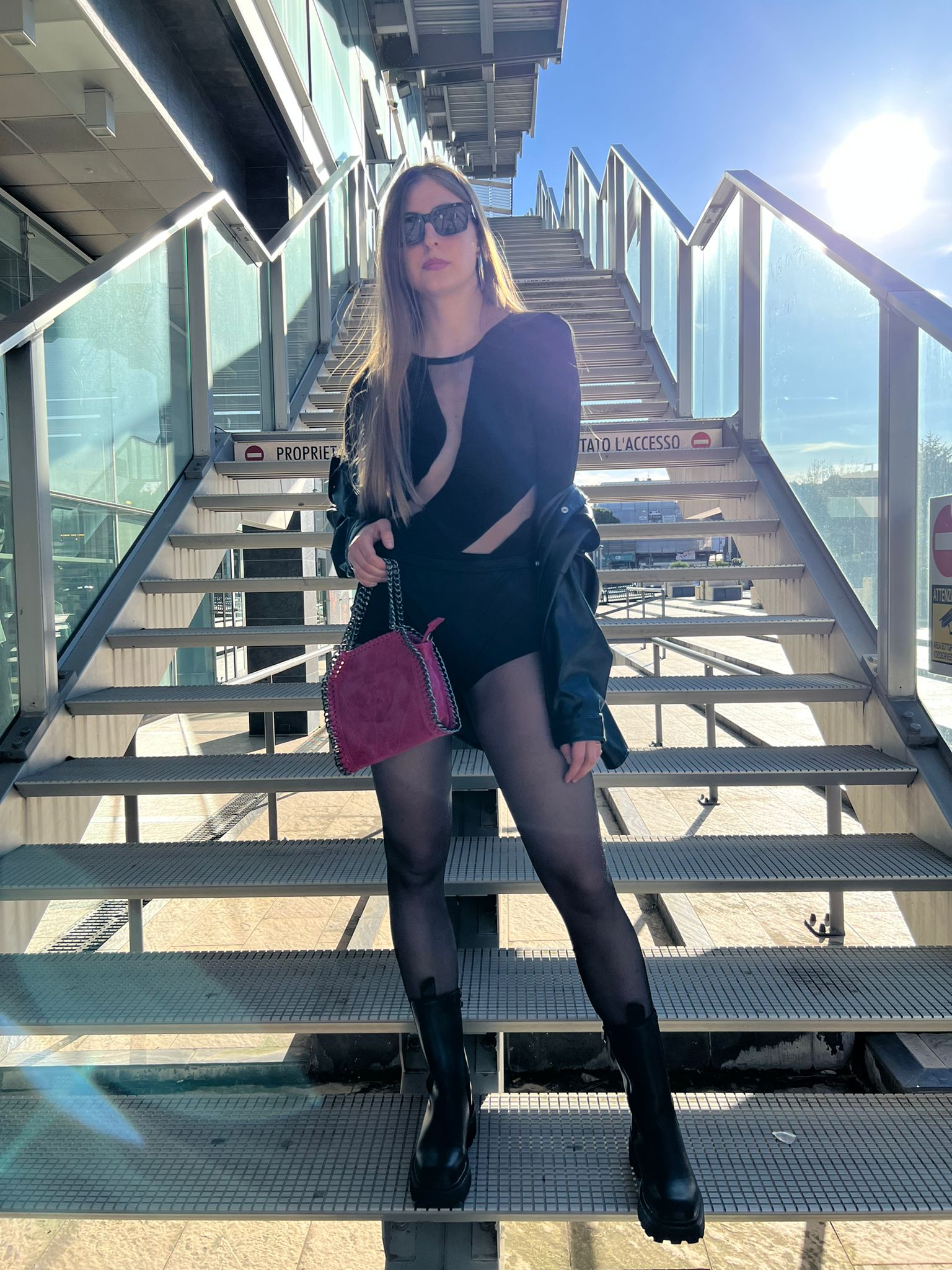 Body nero a maniche lunghe con inserti trasparenti in tulle
