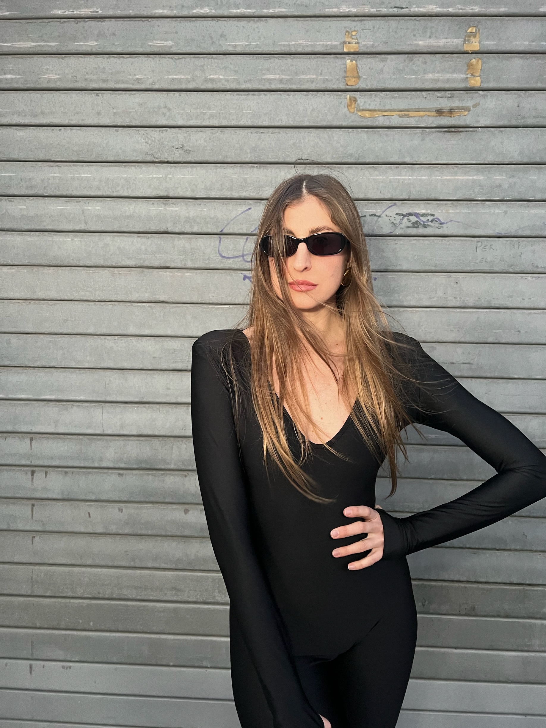 Tuta lunga nera aderente in lycra